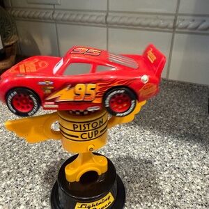 Spinning Light Up Lightning McQueen Red Toy Car with Piston Cup Trophy